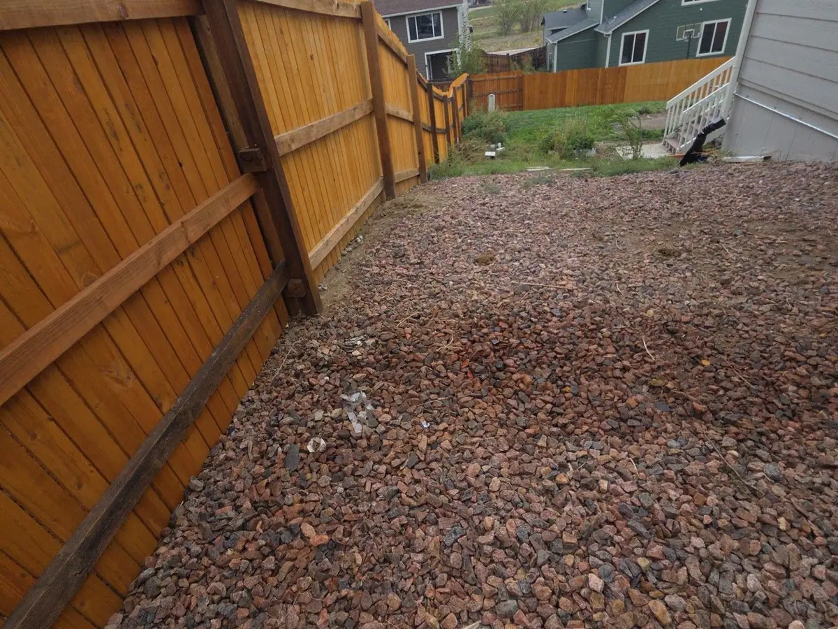 The same fence line raked clear