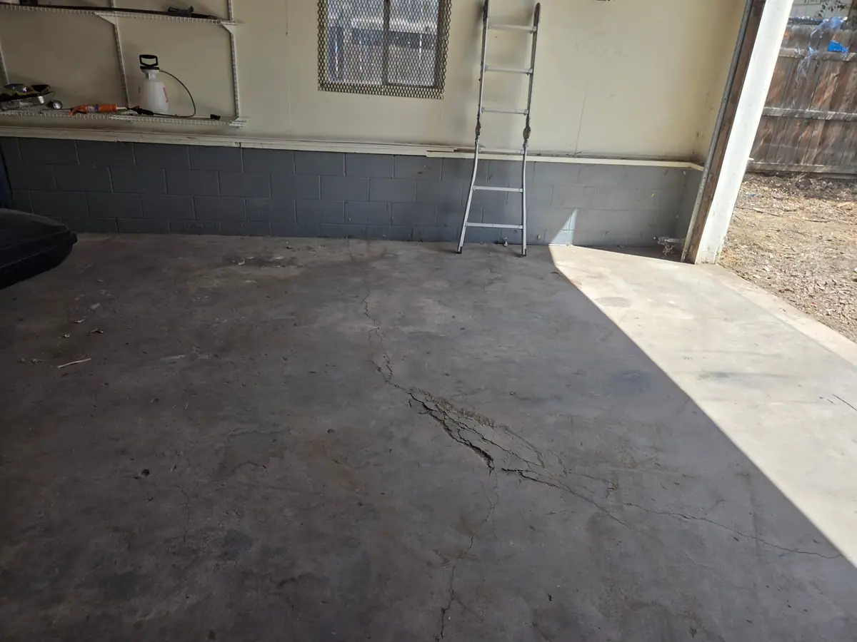 The same garage emptied down to the bare floor