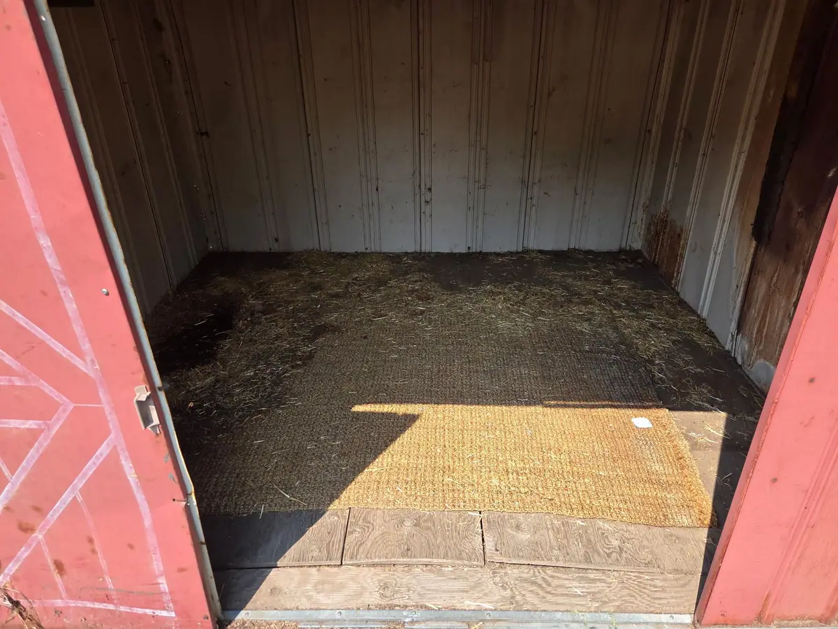 The same shed cleared out down to the floor mat