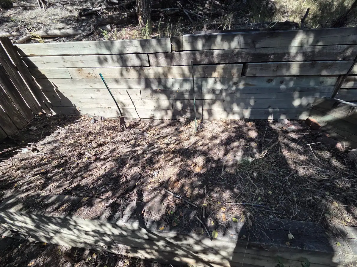 The same retaining wall with the old wood cleared out