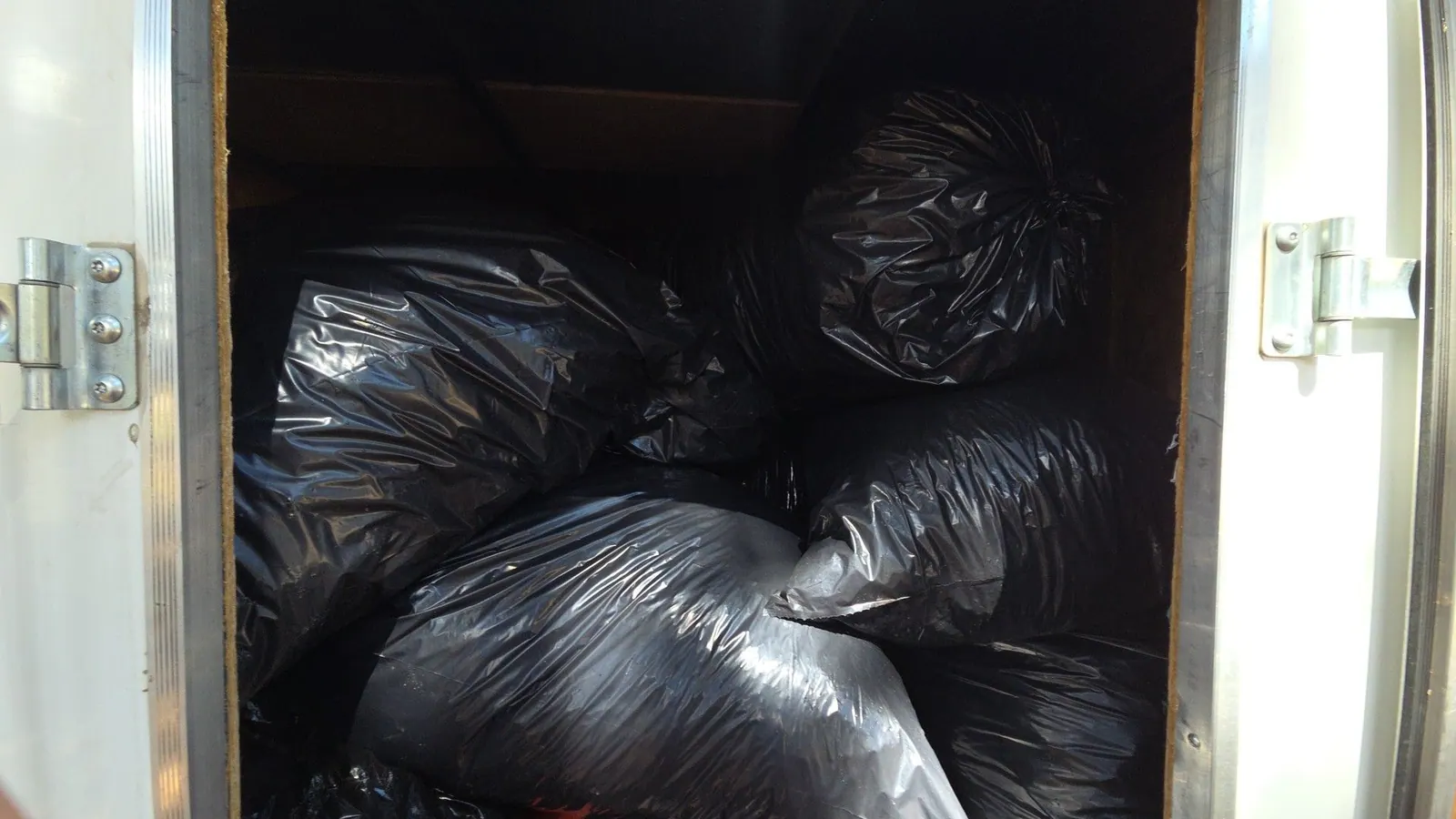 The trailer filled to the roof with bagged junk