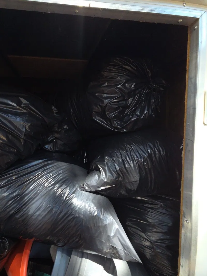 The trailer filled to the roof with bagged junk