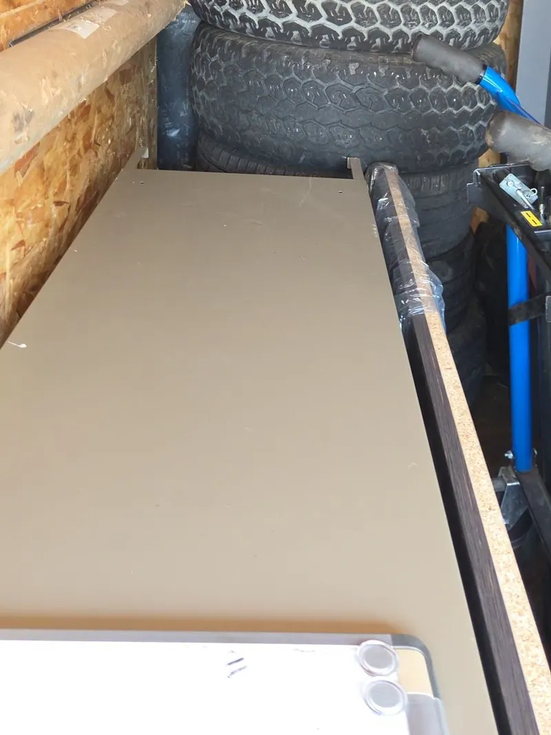 Tires and a fridge loaded in the cargo trailer